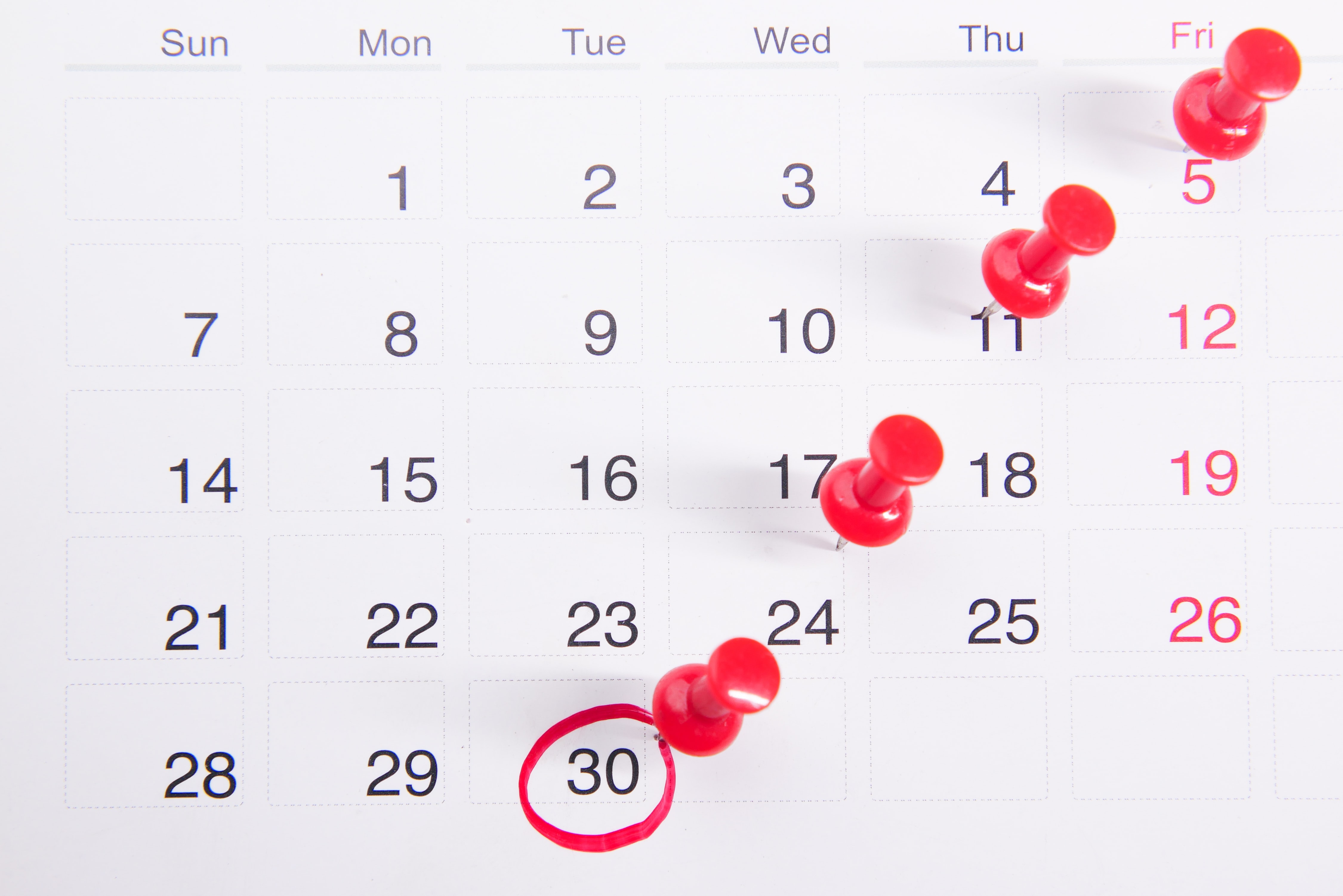 Calendar with bright pins on certain dates